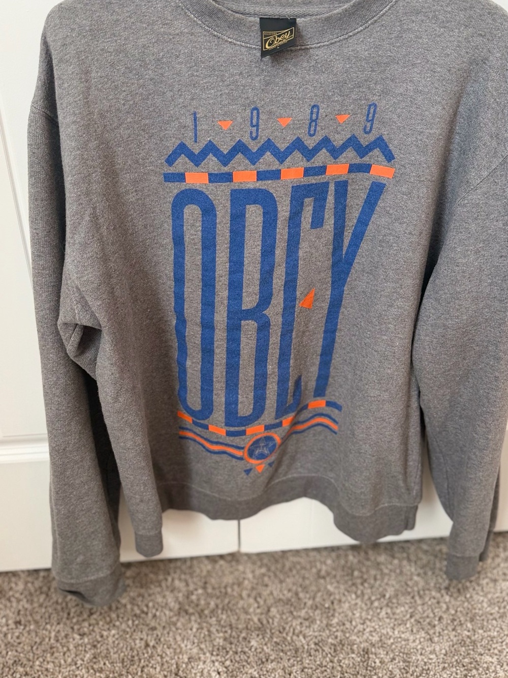 Obey Men’s Gray Crewneck Sweater with Blue and Orange Graphic